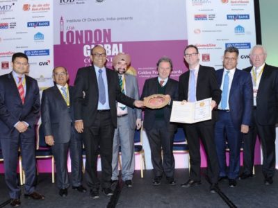 James Robey and Somnath Chatterjee collecting Golden Peacock Award for Sustainability for Capgemini India